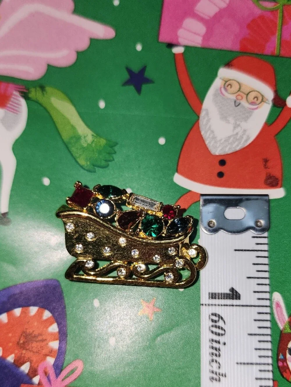 Monet Gold-tone Festive Sleigh Brooch with Multicolor Rhinestones